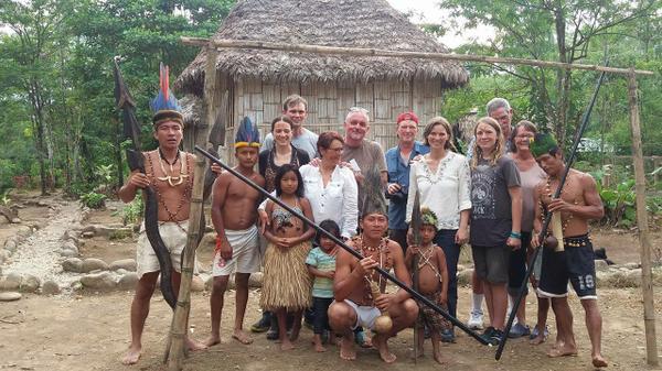 Image of the author and her family in the jungles of Ecuador, surrounded by local indigenous people