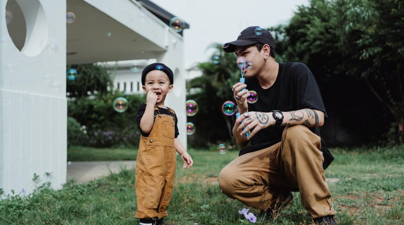 Dad and child blowing bubbles