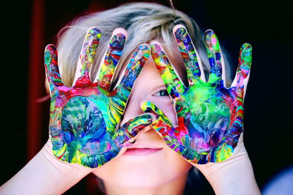 Child with paint on hands