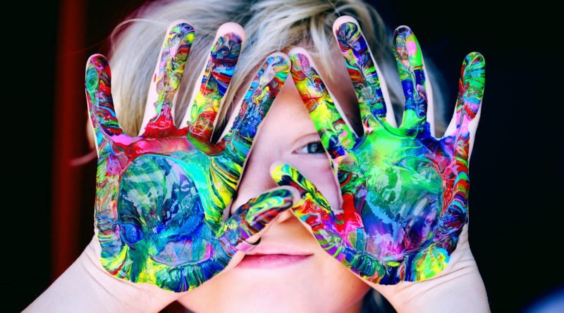 Child with paint on hands